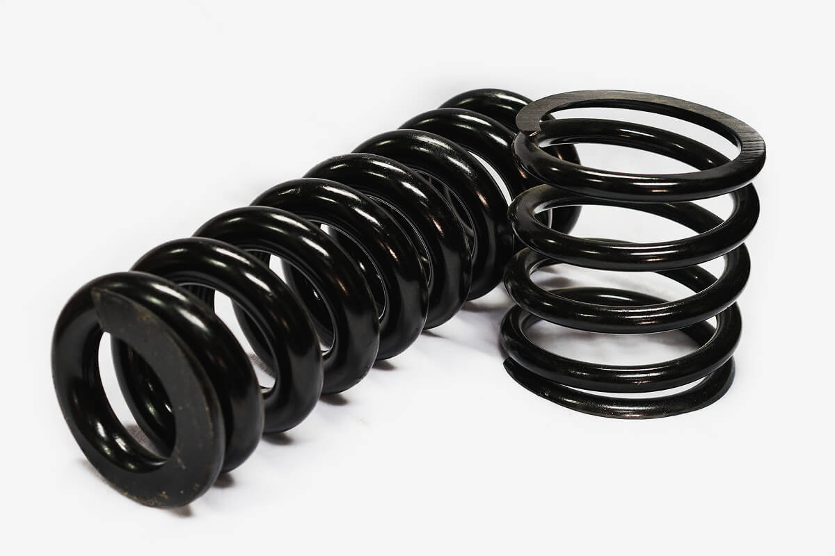 Black helical spring, the barrel is larger in the middle.